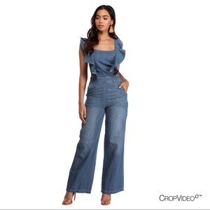Ruffle denim jumpsuit with pockets.